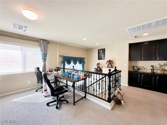 carpeted office with crown molding