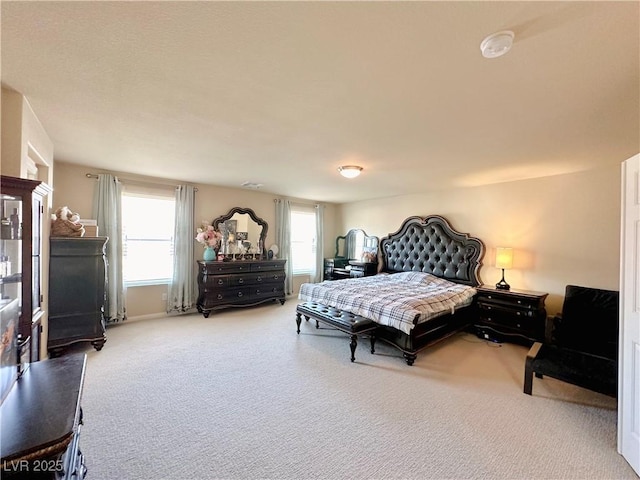 bedroom featuring carpet flooring and multiple windows