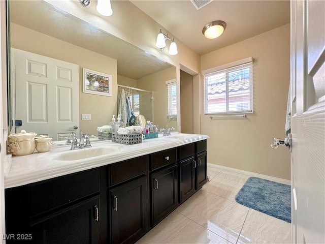 bathroom featuring a shower with curtain and vanity