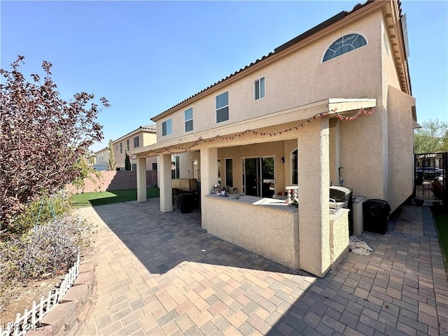 back of house featuring a patio