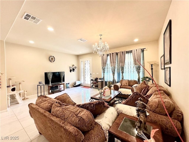 living room with light tile patterned floors and an inviting chandelier