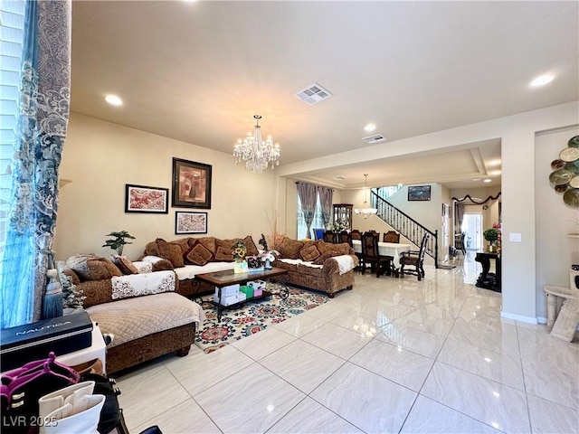 living room featuring a notable chandelier