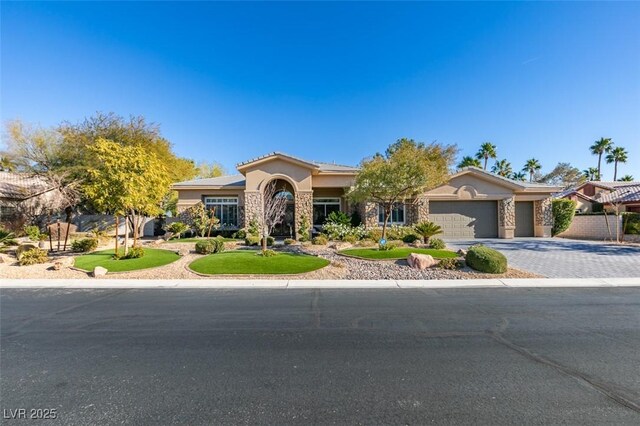 mediterranean / spanish-style home with a garage