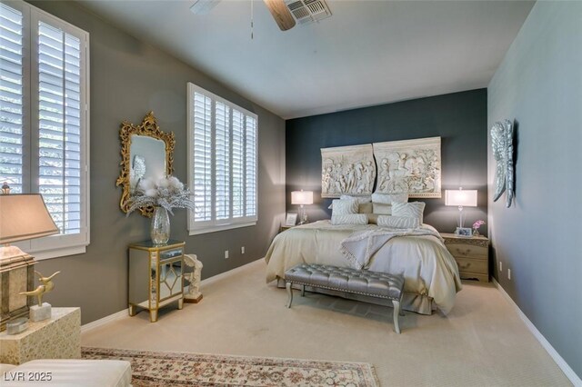 bedroom with ceiling fan and carpet floors