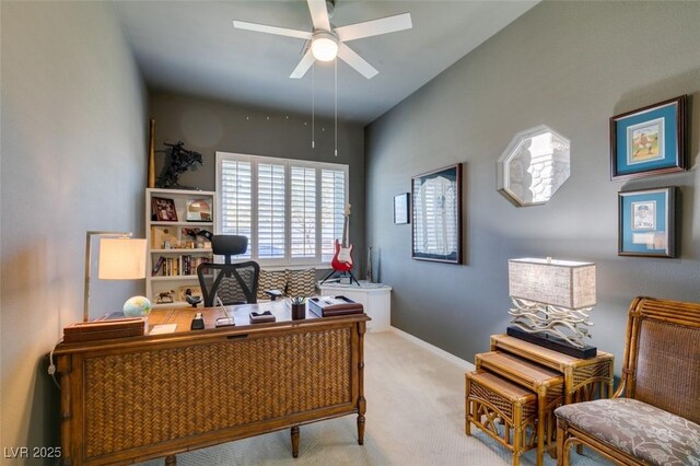 carpeted office featuring ceiling fan