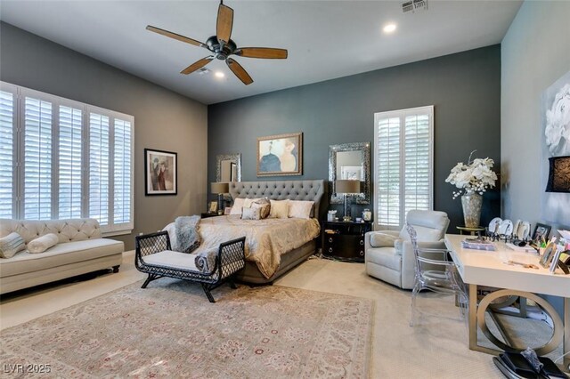 bedroom featuring multiple windows and ceiling fan