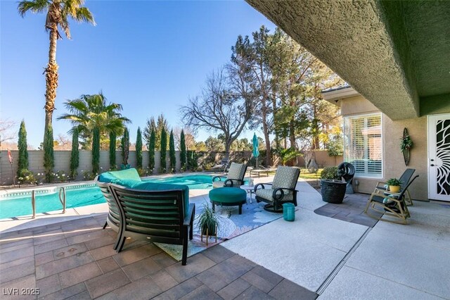 view of patio / terrace featuring a fenced in pool