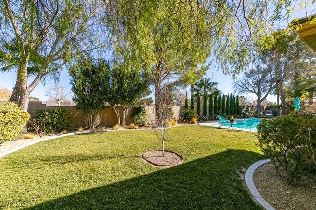 view of yard featuring a fenced in pool