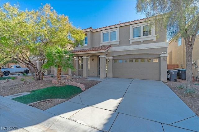 mediterranean / spanish-style home with a garage