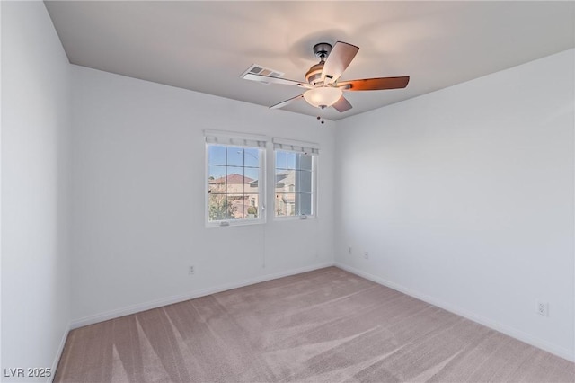 unfurnished room featuring light carpet and ceiling fan