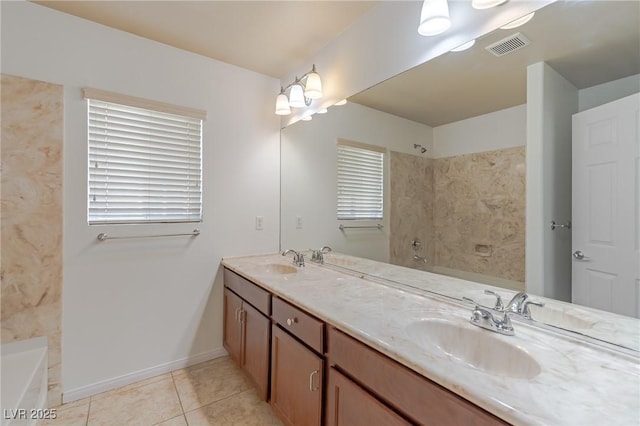 bathroom featuring vanity, tile patterned flooring, and a bath