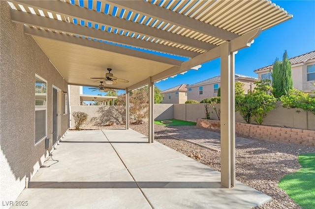 view of patio featuring ceiling fan and a pergola