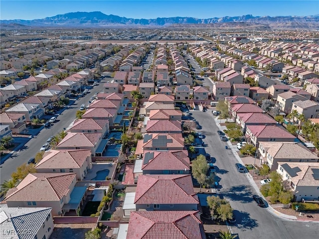 birds eye view of property featuring a mountain view