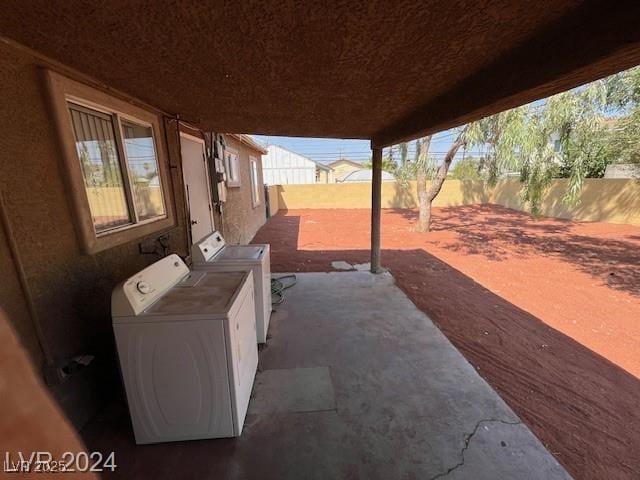 view of patio featuring washer and clothes dryer