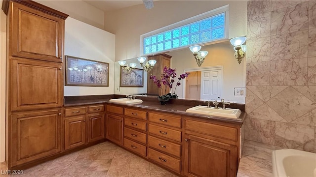 bathroom with a tub and vanity