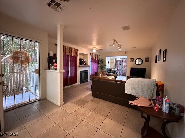 tiled living room with decorative columns