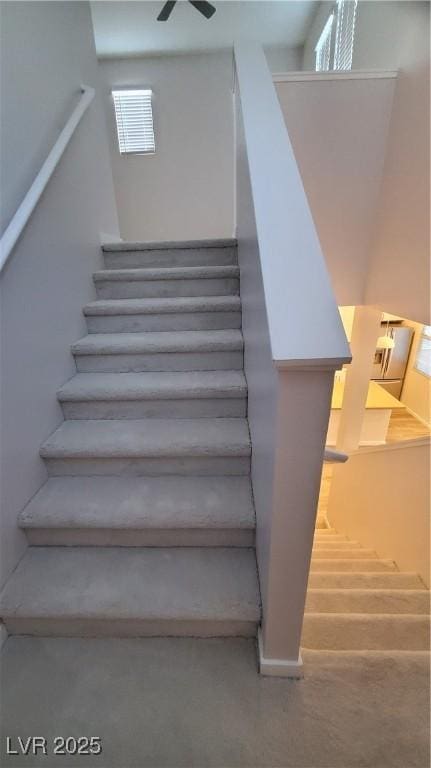 11251 Hidden Peak Ave Unit 212, Las Vegas, NV 89135 - stairs featuring ceiling fan and baseboards