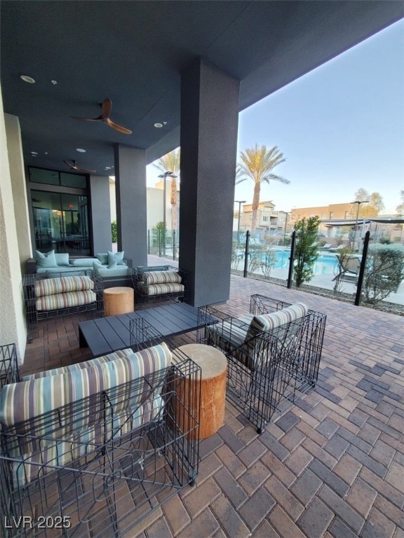 view of patio / terrace featuring an outdoor living space and ceiling fan