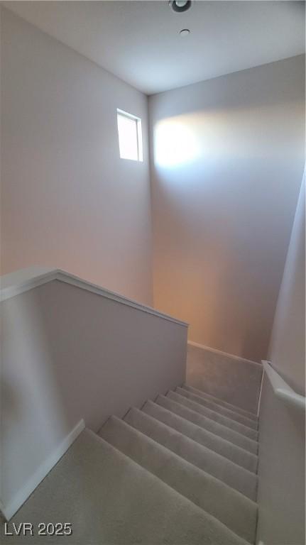 11251 Hidden Peak Ave Unit 212, Las Vegas, NV 89135 - stairway with carpet flooring and baseboards
