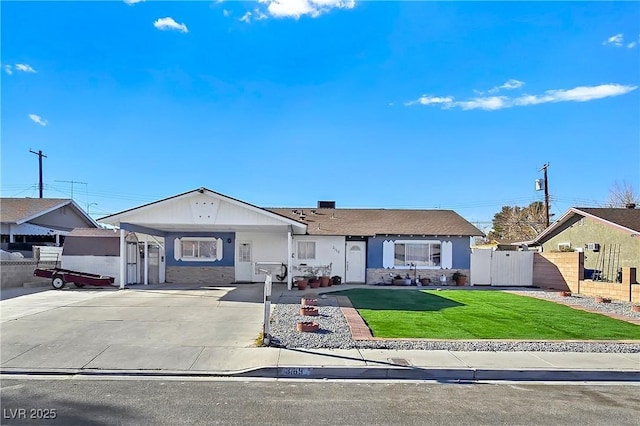 ranch-style house with a carport and a front yard