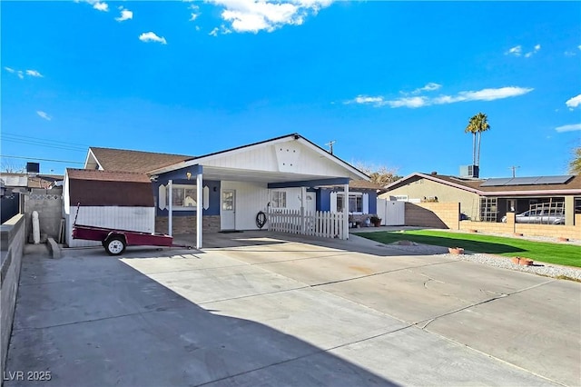 single story home featuring a carport