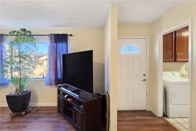 living room with dark hardwood / wood-style flooring and a textured ceiling