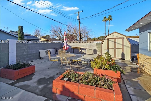 view of patio / terrace with a storage unit