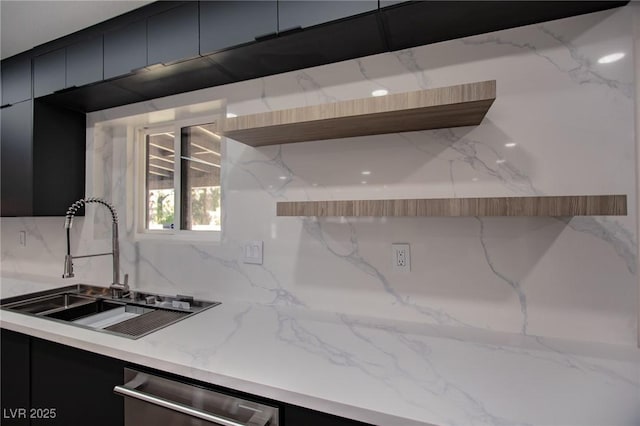 kitchen featuring dishwasher, tasteful backsplash, and sink