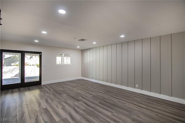 unfurnished room featuring hardwood / wood-style flooring