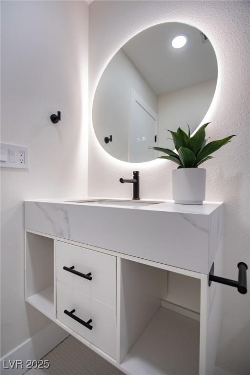 bathroom featuring tile patterned floors and vanity