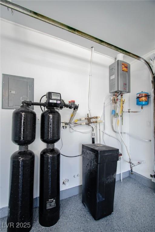 utility room featuring water heater