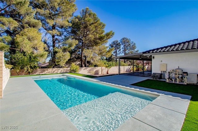 view of pool with ceiling fan and a patio