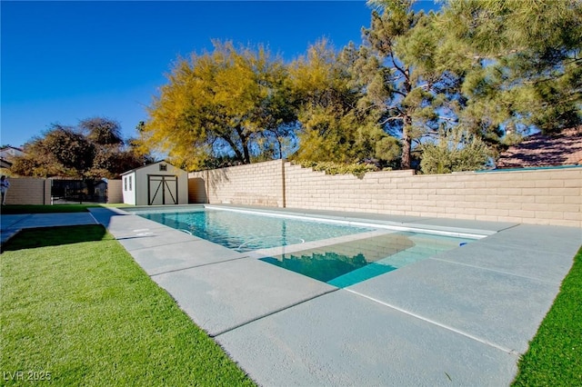 view of swimming pool featuring a lawn and a storage unit