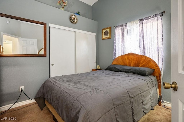 carpeted bedroom featuring a closet