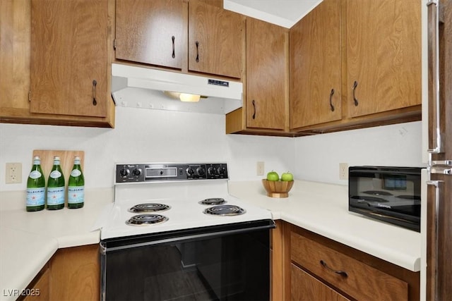 kitchen with stainless steel fridge and white electric stove