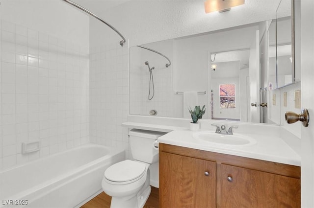 full bathroom featuring vanity, toilet, and shower / tub combination