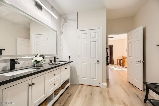 bathroom with vanity and wood-type flooring