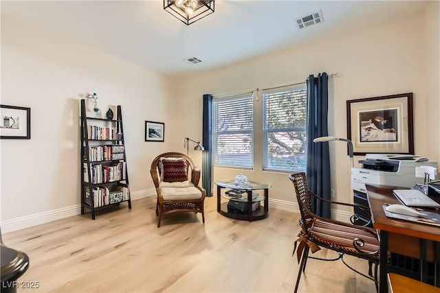 office area with light hardwood / wood-style floors