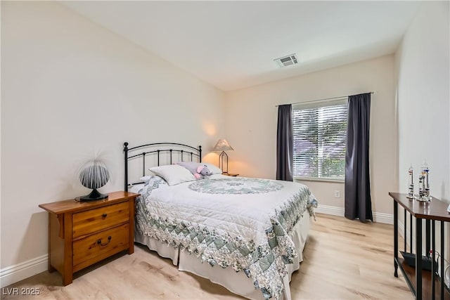 bedroom with light wood-type flooring