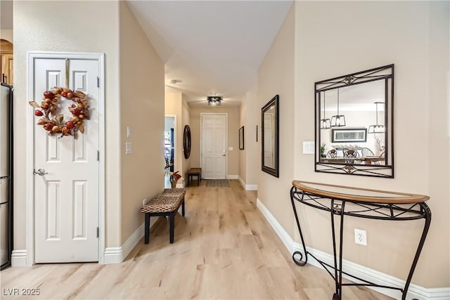 hallway with light wood-type flooring