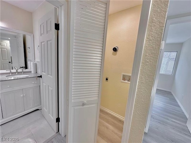 bathroom featuring vanity and hardwood / wood-style floors