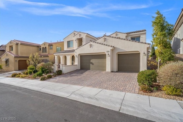 mediterranean / spanish-style home featuring a garage