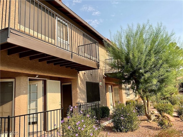 view of property exterior with a balcony