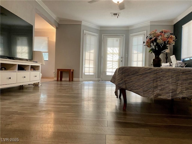 bedroom with hardwood / wood-style floors, ceiling fan, ornamental molding, and access to outside