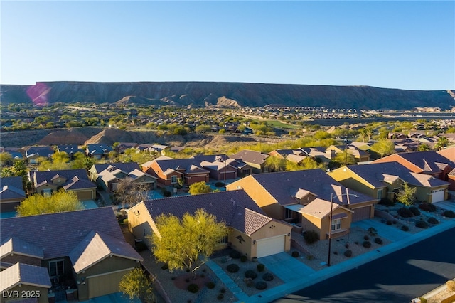 birds eye view of property featuring a mountain view