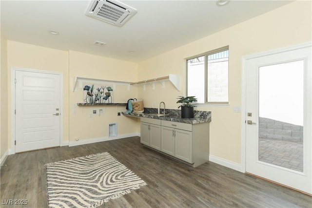 kitchen with sink and dark wood-type flooring