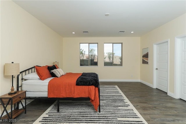 bedroom featuring dark hardwood / wood-style flooring