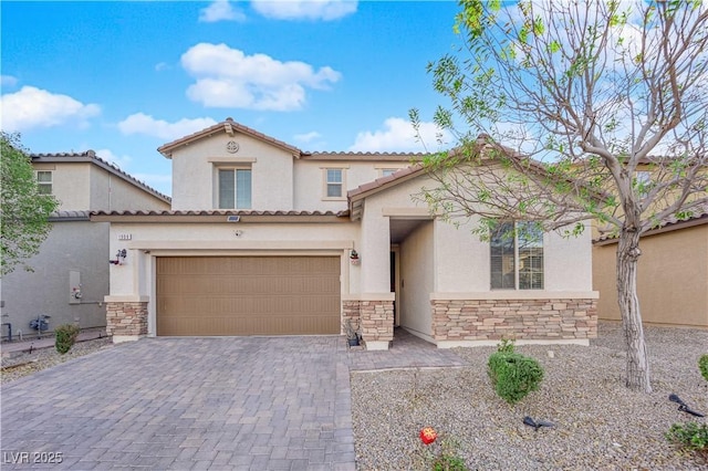 mediterranean / spanish-style house with a garage