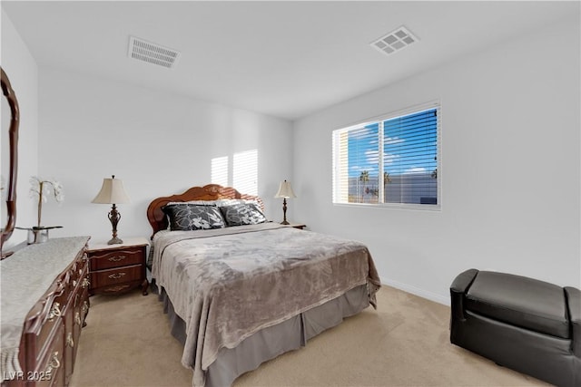 bedroom featuring light carpet