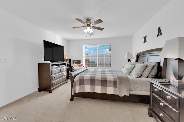 bedroom with light carpet and ceiling fan